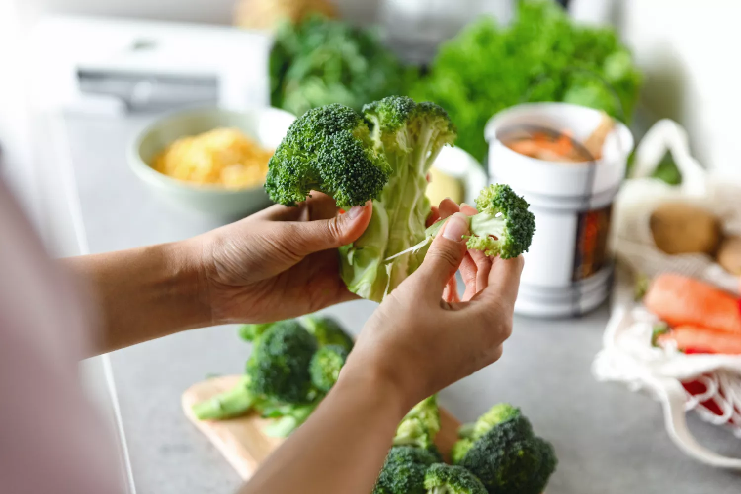 A woman preparing broccoli
